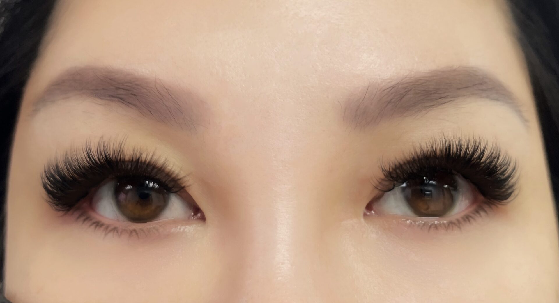 A close up of the eyes with long eyelashes